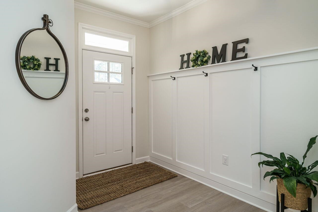 62 Maximus Circle Garner, NC 27529 - Photo 5 of 30 a view of a hallway with wooden floor and entryway