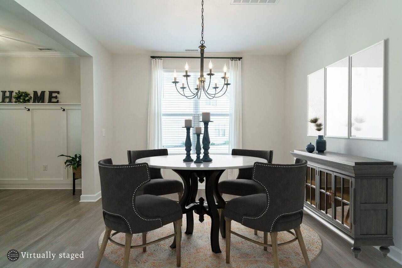 62 Maximus Circle Garner, NC 27529 - Photo 6 of 30 a view of a dining room with furniture window and wooden floor