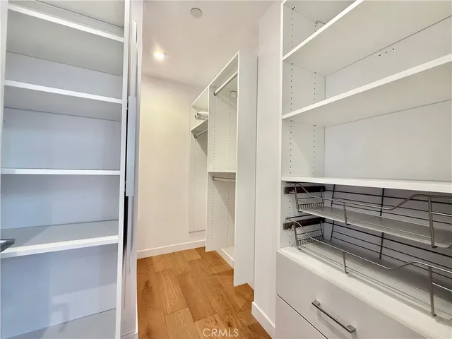 a bathroom with a granite countertop sink mirror toilet and bathtub