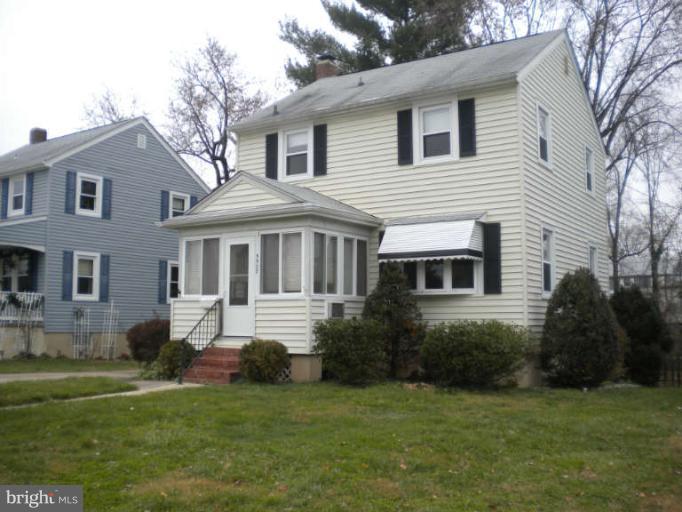 5527 Ashbourne Road Halethorpe, MD 21227 - Photo 1 of 30 a front view of a house with a garden and yard