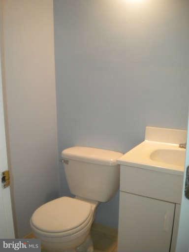 5527 Ashbourne Road Halethorpe, MD 21227 - Photo 11 of 30 a white toilet sitting next to a white wall
