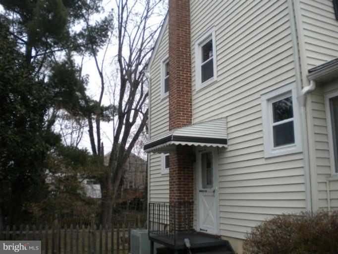 5527 Ashbourne Road Halethorpe, MD 21227 - Photo 22 of 30 a view of a house with a yard