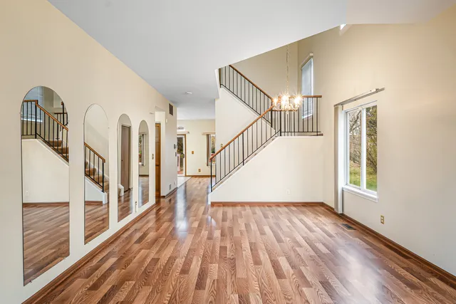 a view of entryway with wooden floor