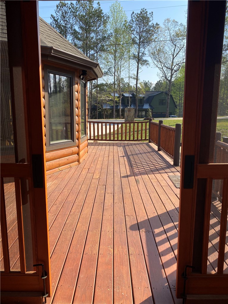 128 McAlister Road West Union, SC 29696 - Photo 3 of 40 A spacious wooden deck provides an inviting outdoor living area for serene enjoyment.