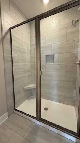 a white toilet sitting next to a white sink