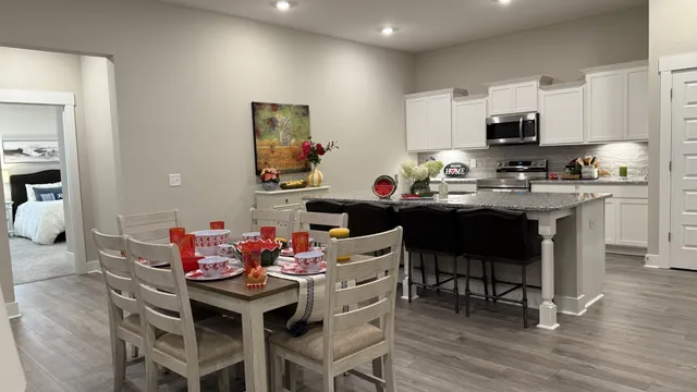 a view of a dining room with furniture and wooden floor