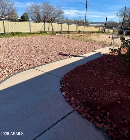 a view of a backyard of the house