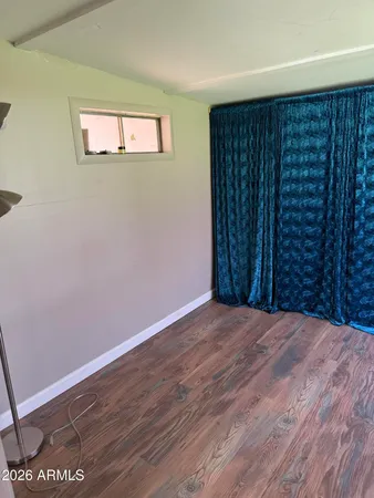 a kitchen with white cabinets sink and appliances