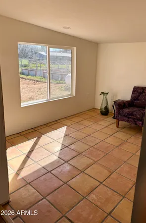 a white toilet sitting next to a white sink