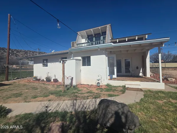 an aerial view of a residential houses with outdoor space