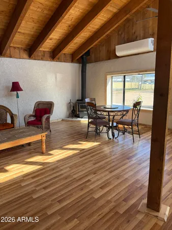 a swimming pool with outdoor seating and yard