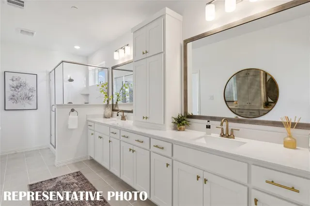 a bedroom with bed couch and window