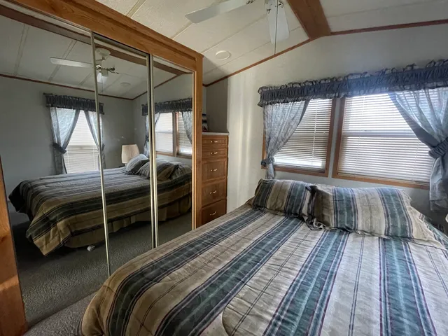 a bed room with a bed and a window