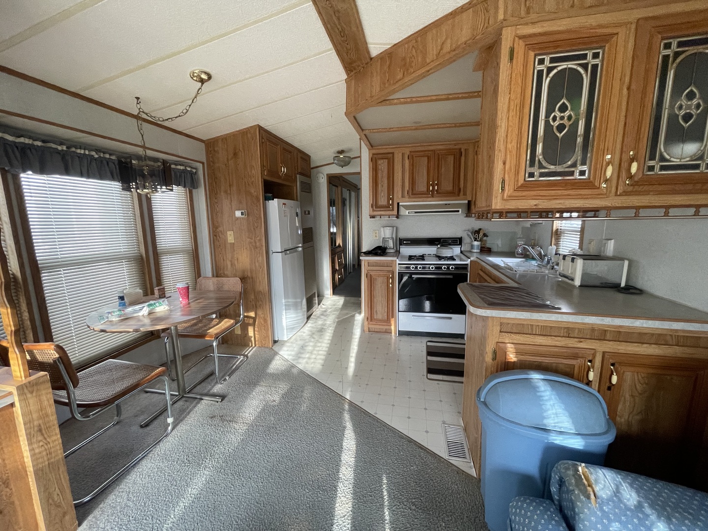 26-204 Woodhaven Lakes Sublette, IL 61367 - Photo 6 of 17 a kitchen with a sink appliances and cabinets