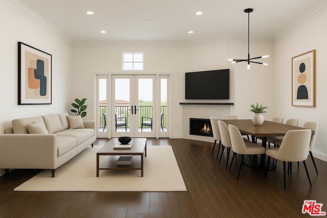 12020 Guerin Street, Unit PH9 Studio City, CA 91604 - Photo 2 of 2 a living room with furniture a fireplace and a flat screen tv