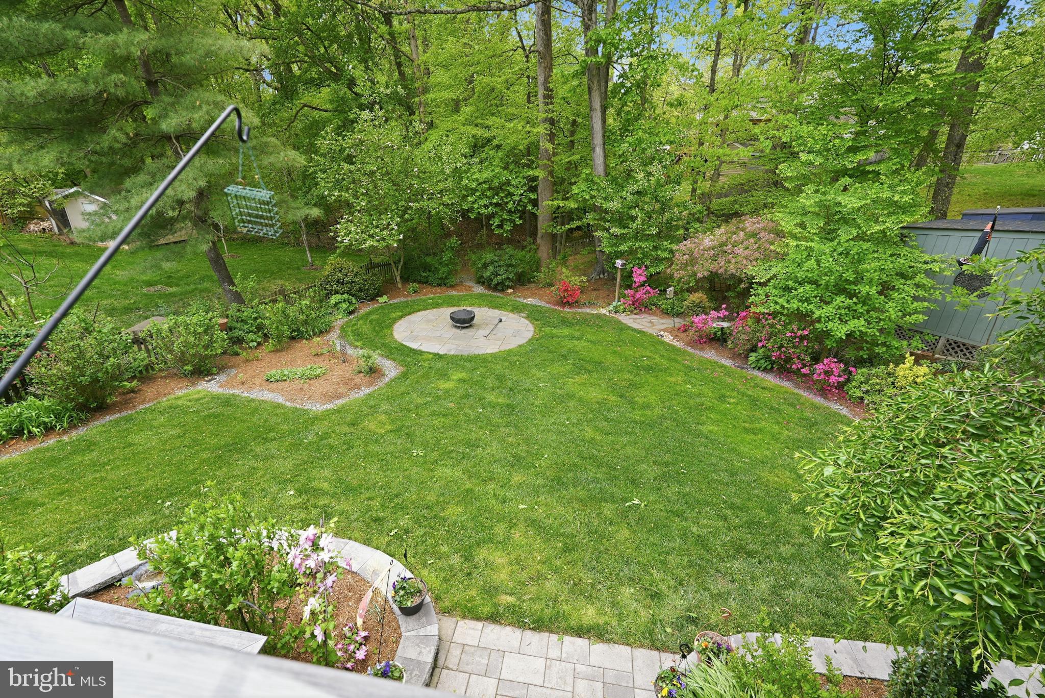 7006 Barnack Drive Springfield, VA 22152 - Photo 55 of 56 a view of a backyard with table and chairs and potted plants