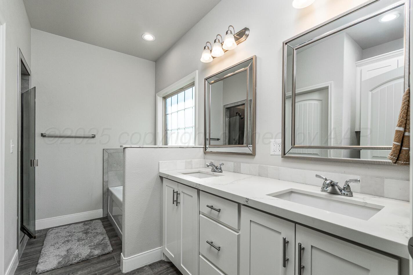 7500 Crestline Drive Amarillo, TX 79119 - Photo 16 of 24 a bathroom with a sink and a mirror