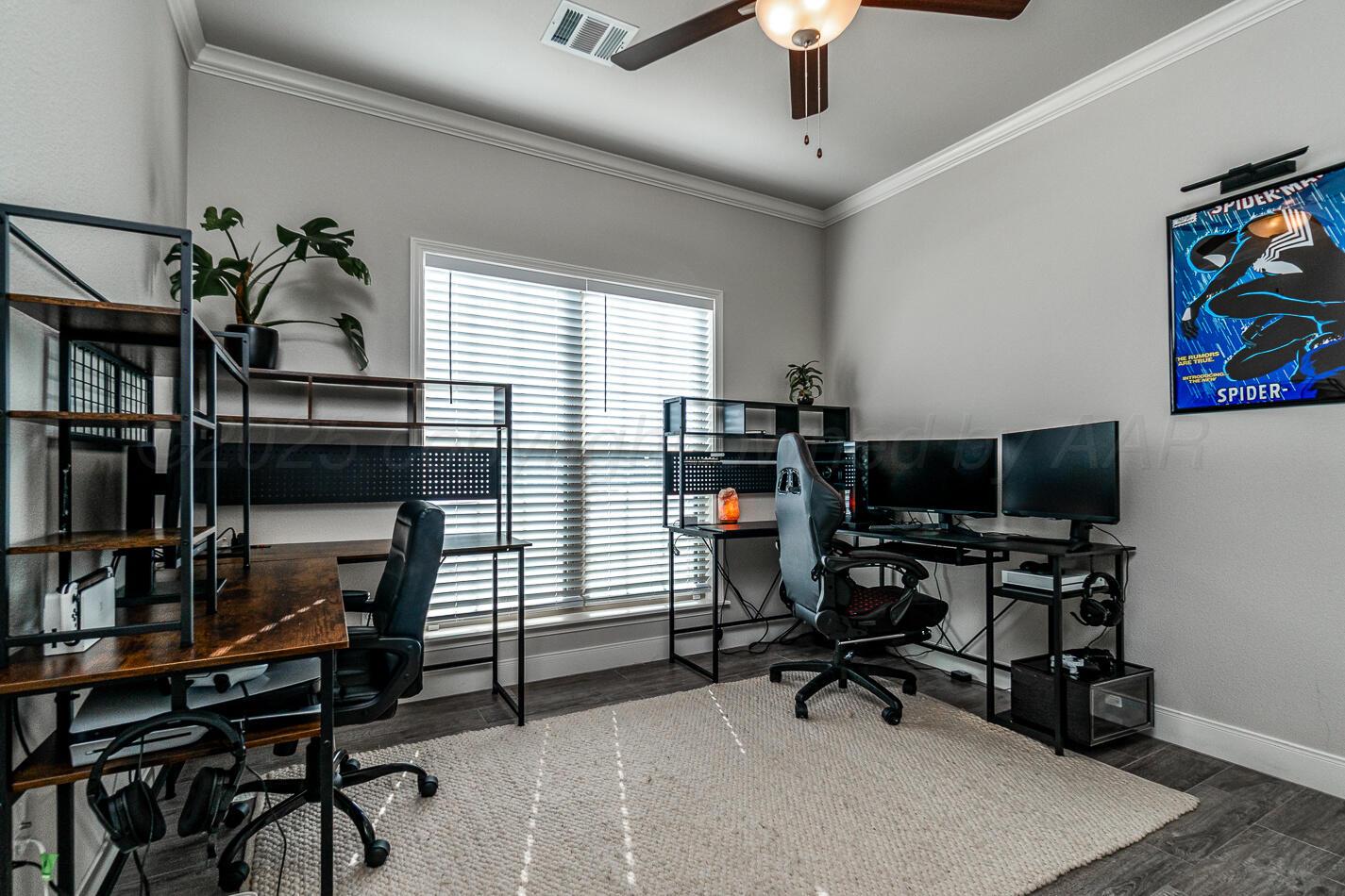 7500 Crestline Drive Amarillo, TX 79119 - Photo 18 of 24 a view of a workspace with furniture and a window