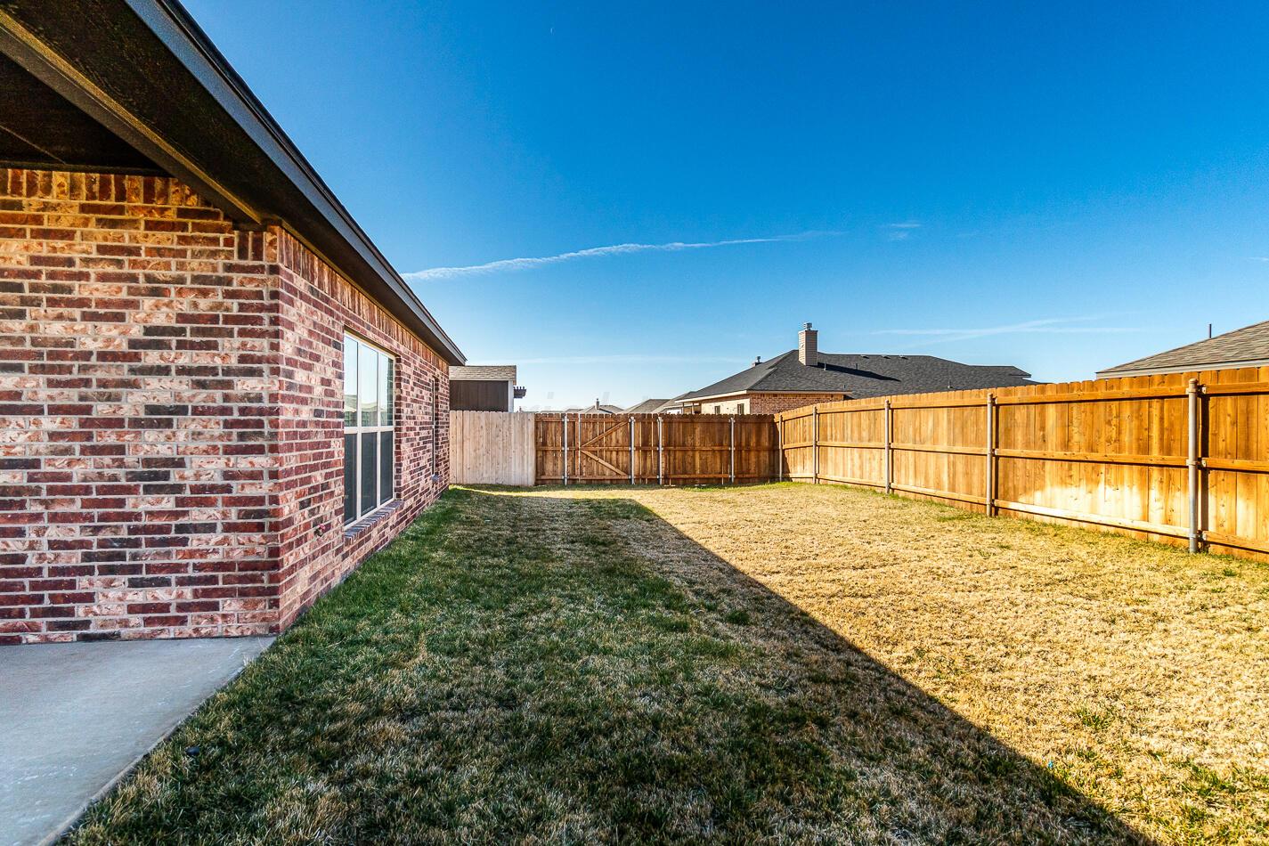 7500 Crestline Drive Amarillo, TX 79119 - Photo 22 of 24 a view of a backyard of a building