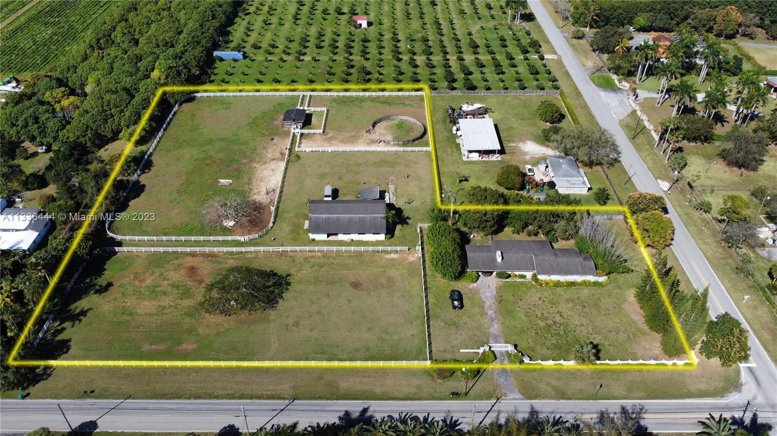 an aerial view of a residential houses with outdoor space