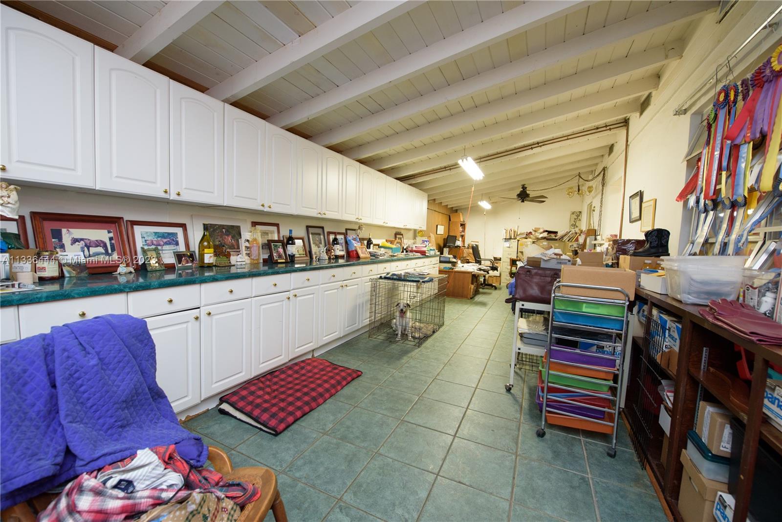 Redlands Homestead, FL 33031 - Photo 19 of 35 a kitchen with stainless steel appliances kitchen island granite countertop lots of clutter and furniture