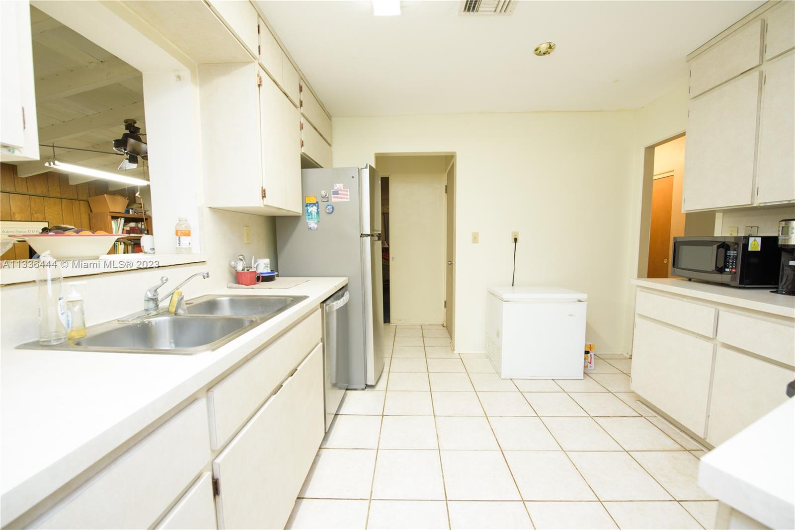 Redlands Homestead, FL 33031 - Photo 20 of 35 a kitchen with a sink a stove and cabinets