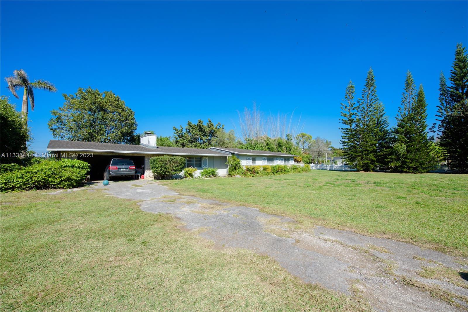 Redlands Homestead, FL 33031 - Photo 2 of 35 a front view of a house with a yard