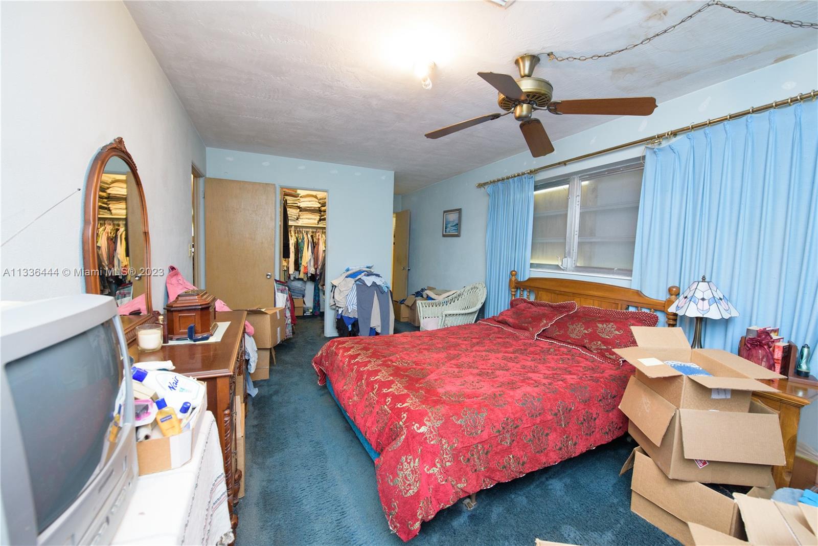 Redlands Homestead, FL 33031 - Photo 24 of 35 a bed room with a bed and a chandelier