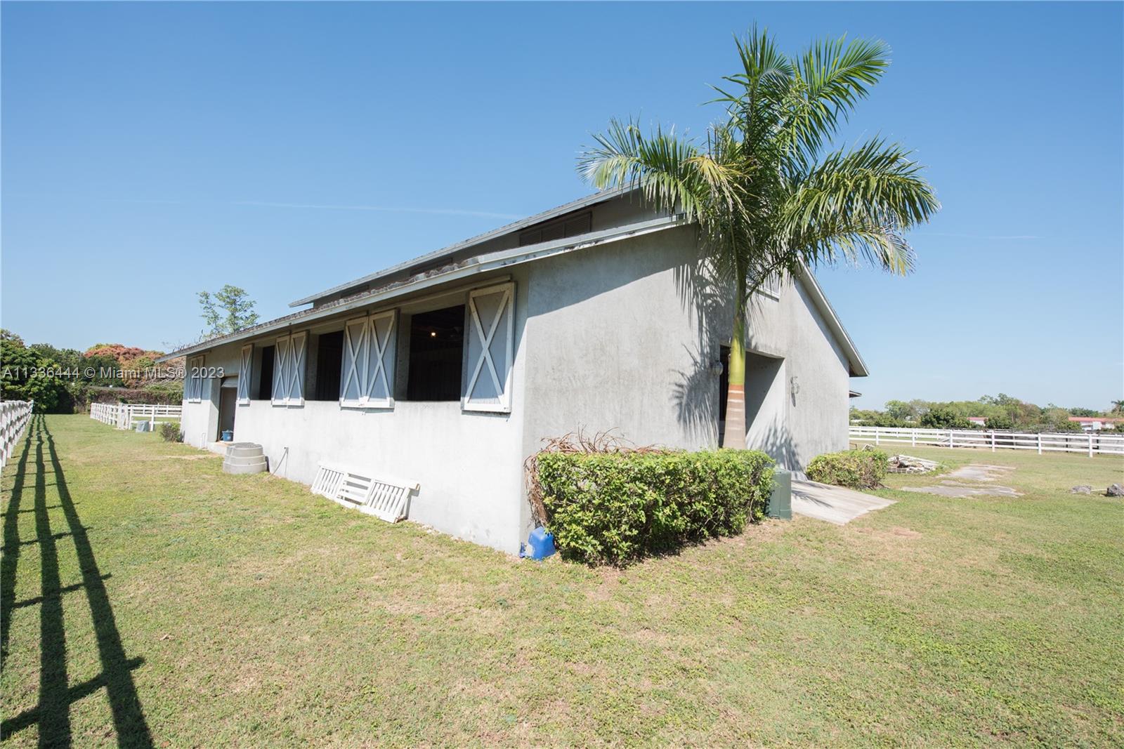 Redlands Homestead, FL 33031 - Photo 28 of 35 a front view of a house with a yard