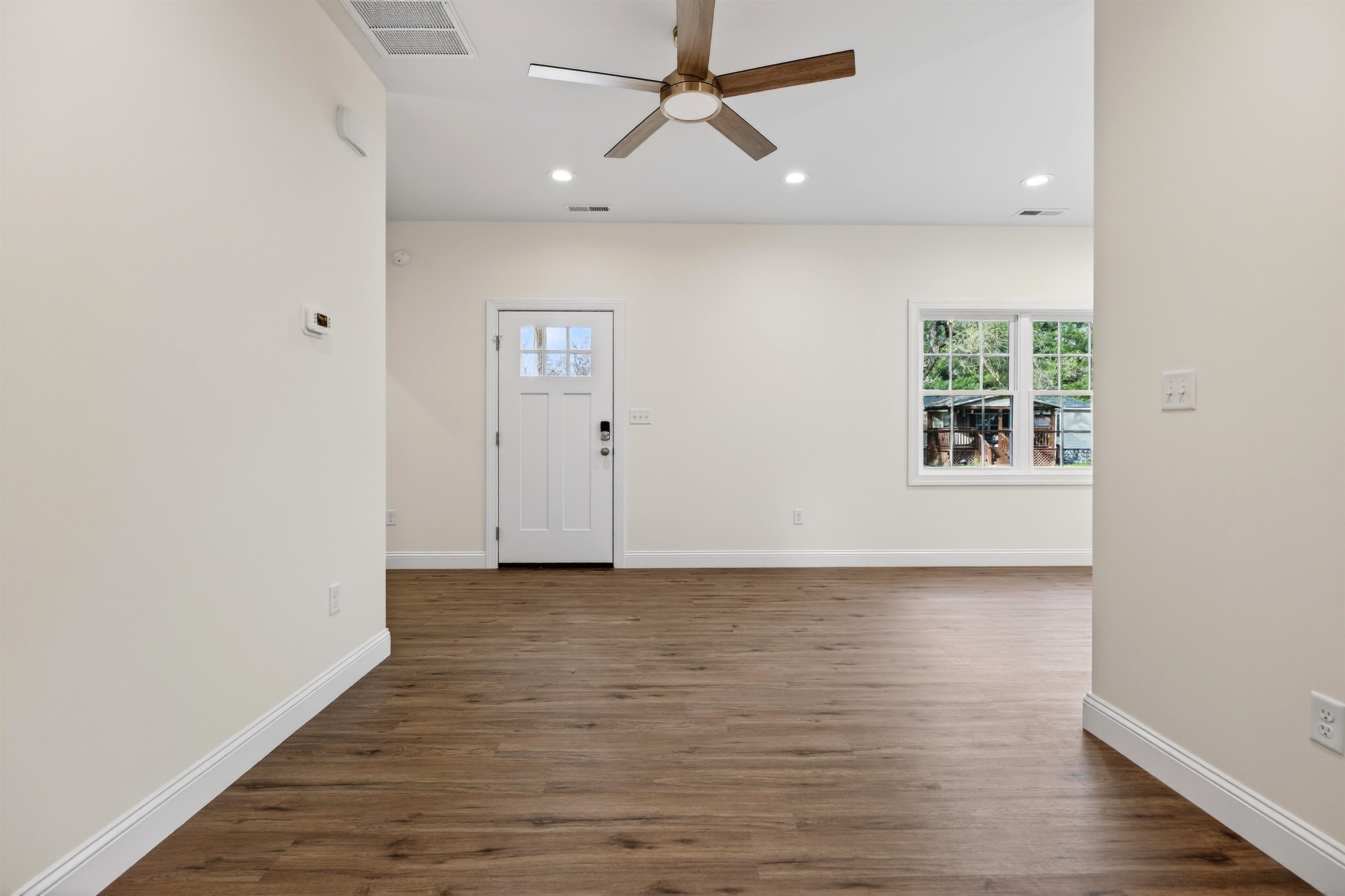 1700 A Street Waynesboro, VA 22980 - Photo 14 of 44 a view of an empty room with wooden floor and a window