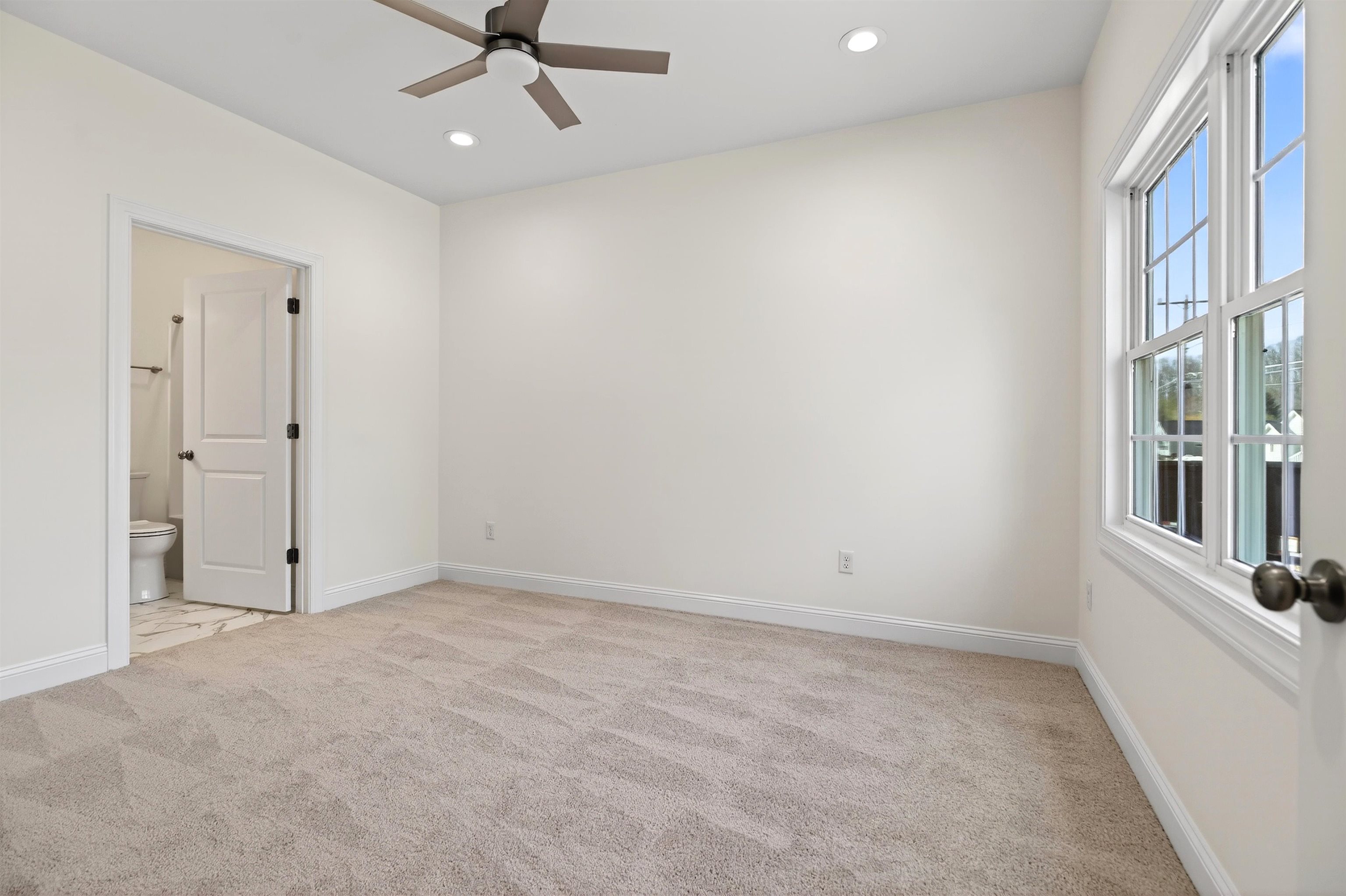 1700 A Street Waynesboro, VA 22980 - Photo 21 of 44 an empty room with chandelier fan and windows