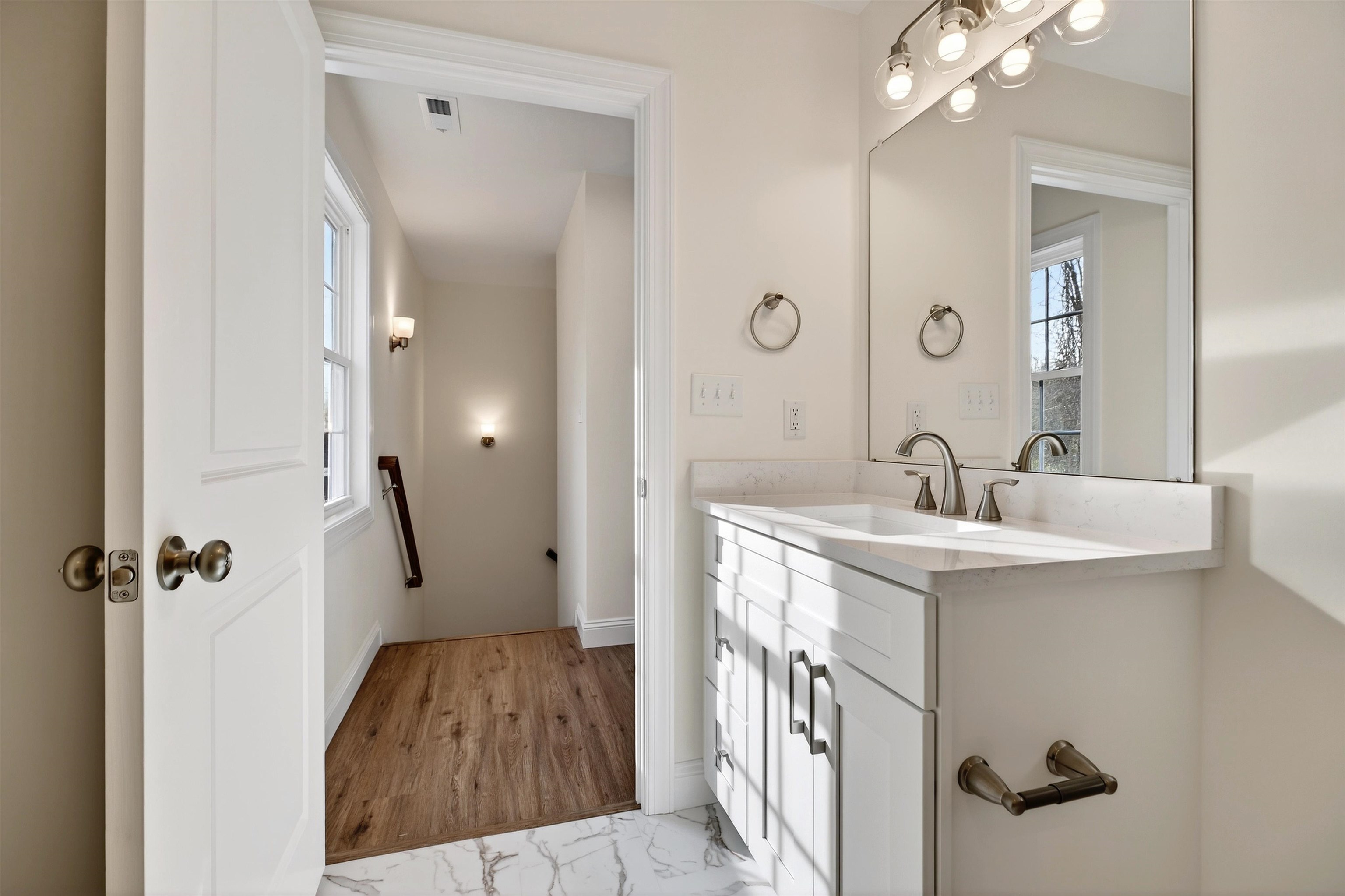 1700 A Street Waynesboro, VA 22980 - Photo 33 of 44 a bathroom with a sink a mirror a vanity and shower