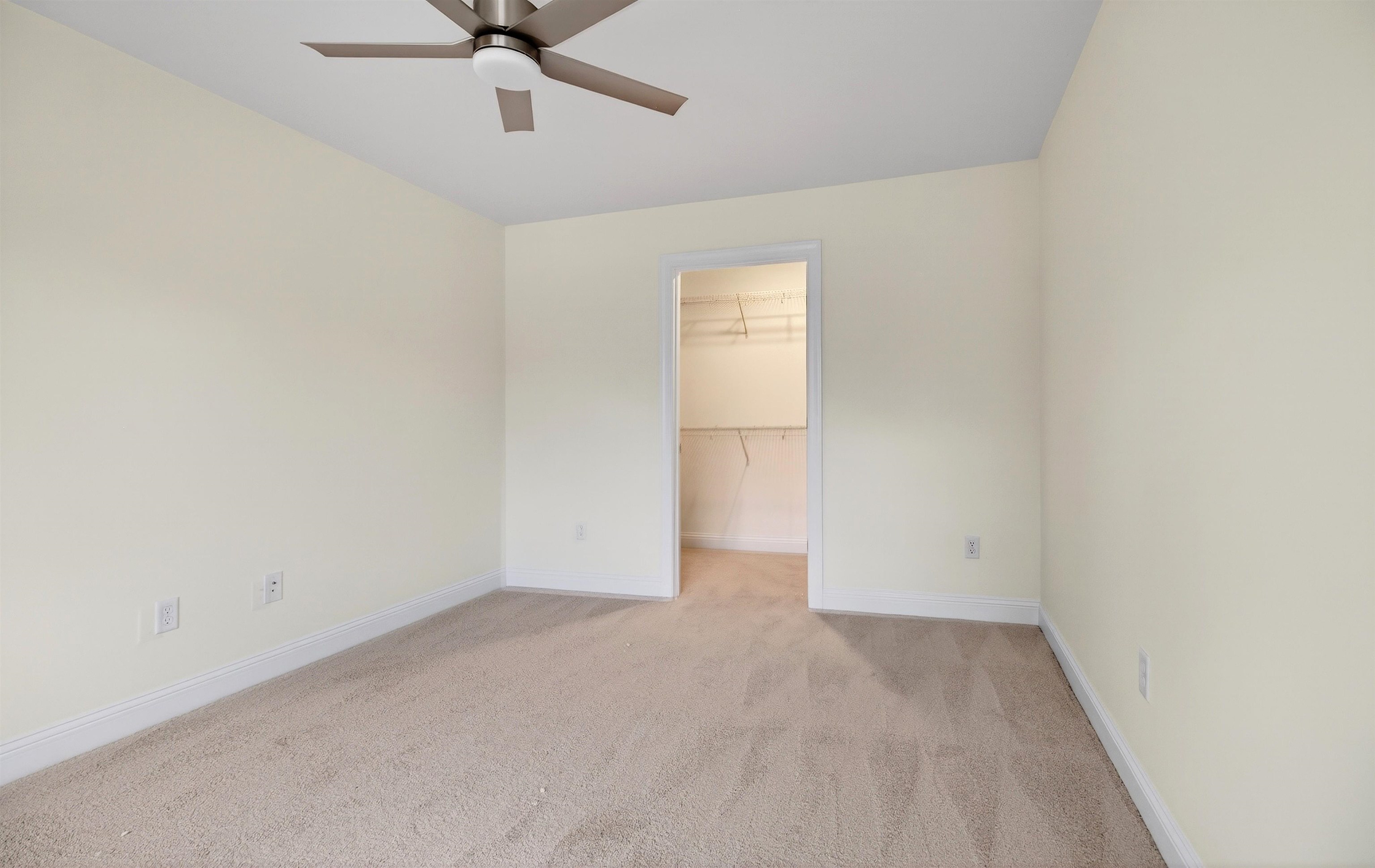 1700 A Street Waynesboro, VA 22980 - Photo 36 of 44 an empty room with a ceiling fan and carpet