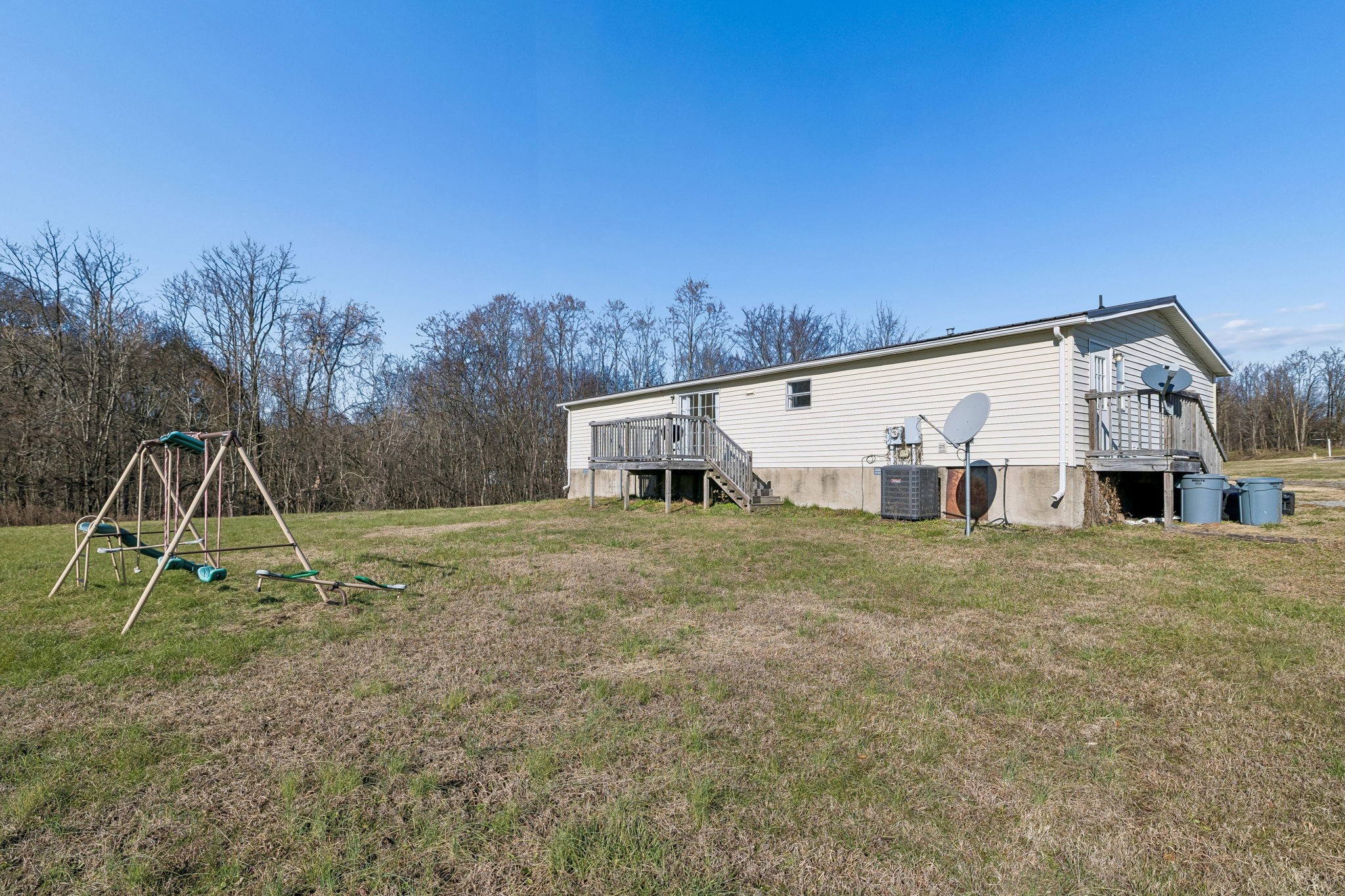 217 Tomlinson Road Lebanon, TN 37087 - Photo 22 of 23 a view of a house with backyard and trees
