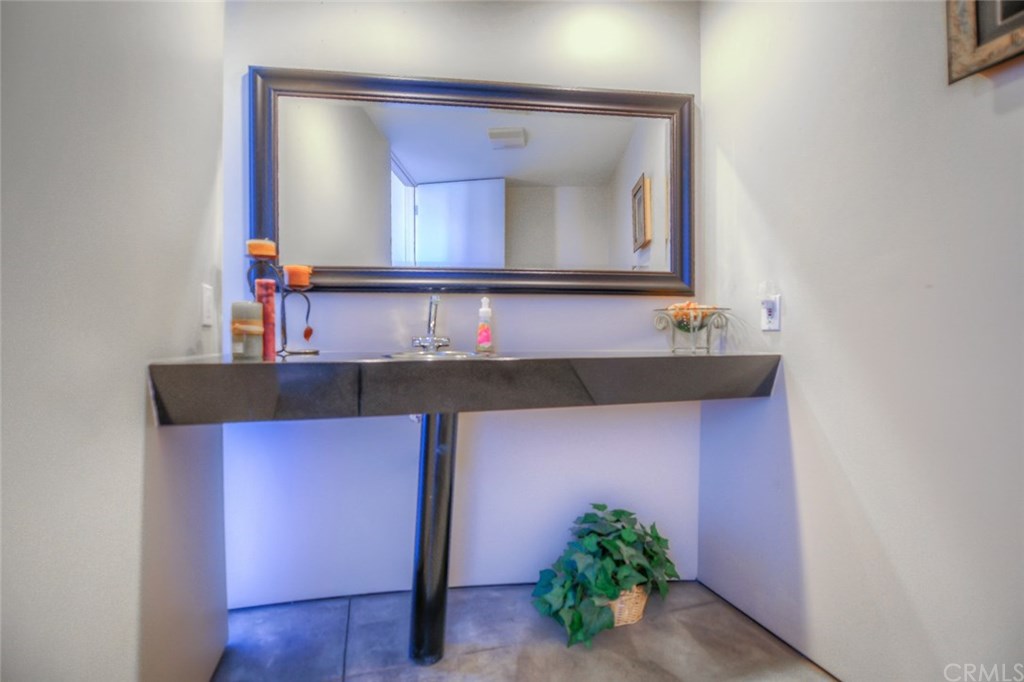 2831 Ridge Drive Laguna Beach, CA 92651 - Photo 11 of 49 a bathroom with a sink and a mirror