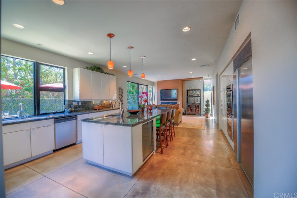 2831 Ridge Drive Laguna Beach, CA 92651 - Photo 16 of 49 a kitchen with stainless steel appliances granite countertop a stove and a refrigerator