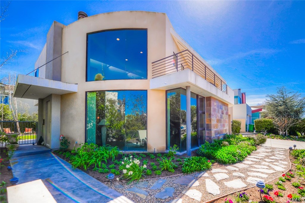 2831 Ridge Drive Laguna Beach, CA 92651 - Photo 2 of 49 a view of a brick house with plants and large tree