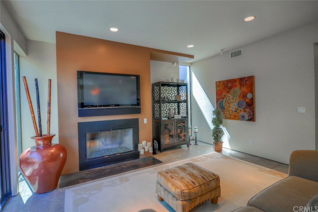 2831 Ridge Drive Laguna Beach, CA 92651 - Photo 22 of 49 a living room with furniture and a flat screen tv