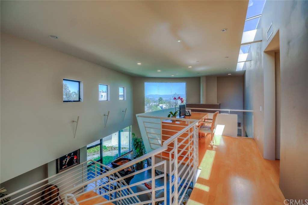 2831 Ridge Drive Laguna Beach, CA 92651 - Photo 26 of 49 a view of a livingroom with furniture a dinning room and stairs