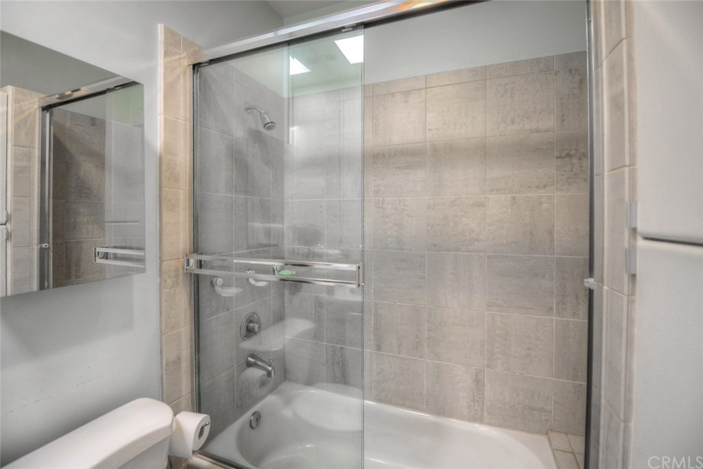2831 Ridge Drive Laguna Beach, CA 92651 - Photo 29 of 49 a bathroom with a glass shower door