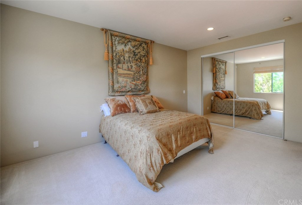 2831 Ridge Drive Laguna Beach, CA 92651 - Photo 30 of 49 a bedroom with a bed and window