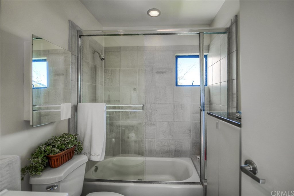 2831 Ridge Drive Laguna Beach, CA 92651 - Photo 31 of 49 a bathroom with a shower and a toilet