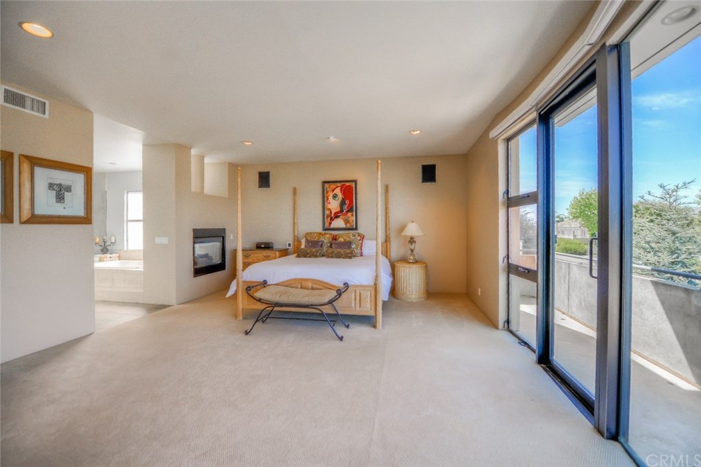 2831 Ridge Drive Laguna Beach, CA 92651 - Photo 32 of 49 a bedroom with furniture and a window