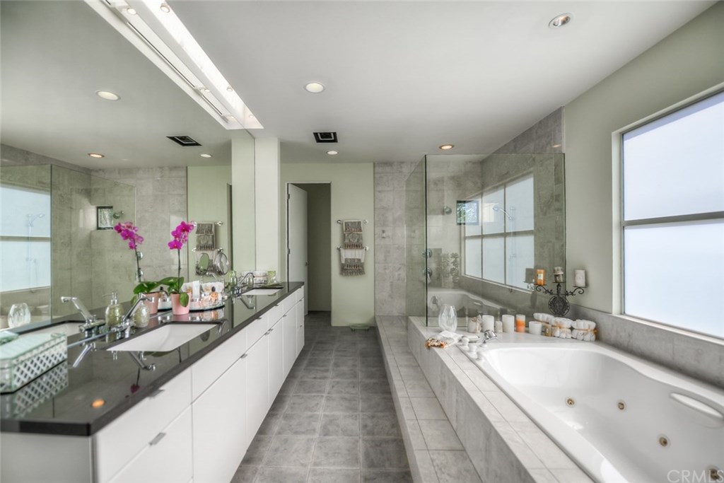 2831 Ridge Drive Laguna Beach, CA 92651 - Photo 38 of 49 a large bathroom with a large tub and sink