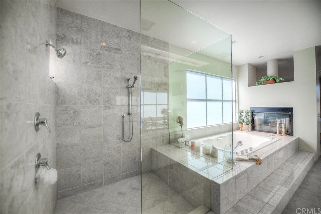 2831 Ridge Drive Laguna Beach, CA 92651 - Photo 39 of 49 a bathroom with a granite countertop shower bathtub and sink