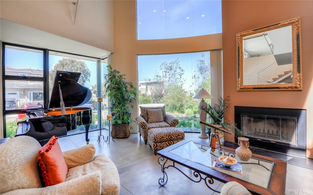 2831 Ridge Drive Laguna Beach, CA 92651 - Photo 9 of 49 a living room with furniture and a fireplace