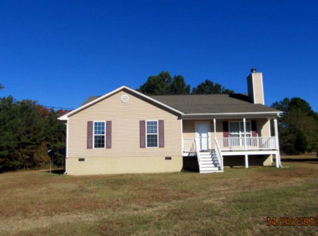 437 Comer Road Gray, GA 31032 - Photo 1 of 20 a view of a house with a yard