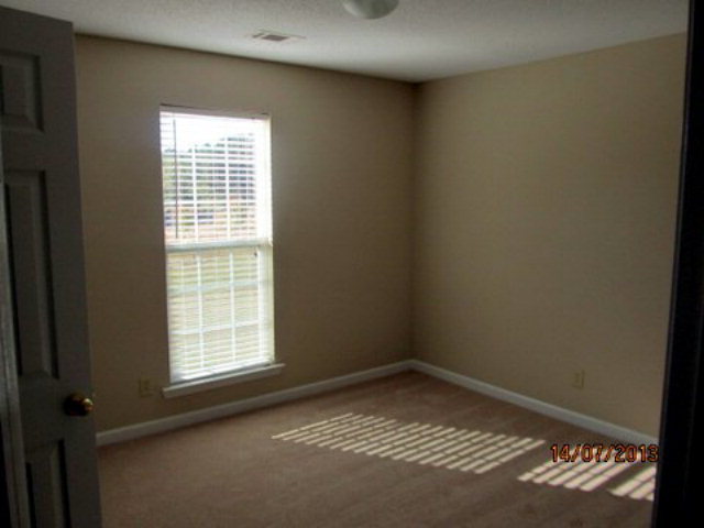 437 Comer Road Gray, GA 31032 - Photo 12 of 20 an empty room with a window