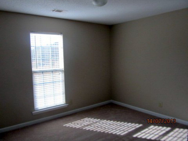 437 Comer Road Gray, GA 31032 - Photo 14 of 20 an empty room with a window