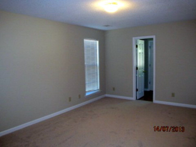 437 Comer Road Gray, GA 31032 - Photo 15 of 20 an empty room with windows